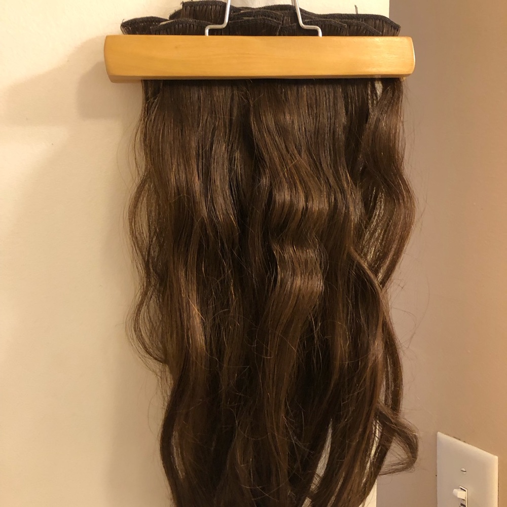 Brown hair extensions. I am unsure of the exact hair shade and brand name.